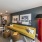 a living room with a couch and a lamp