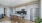 a kitchen with chairs and a dining table