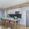 a kitchen with chairs and a dining table
