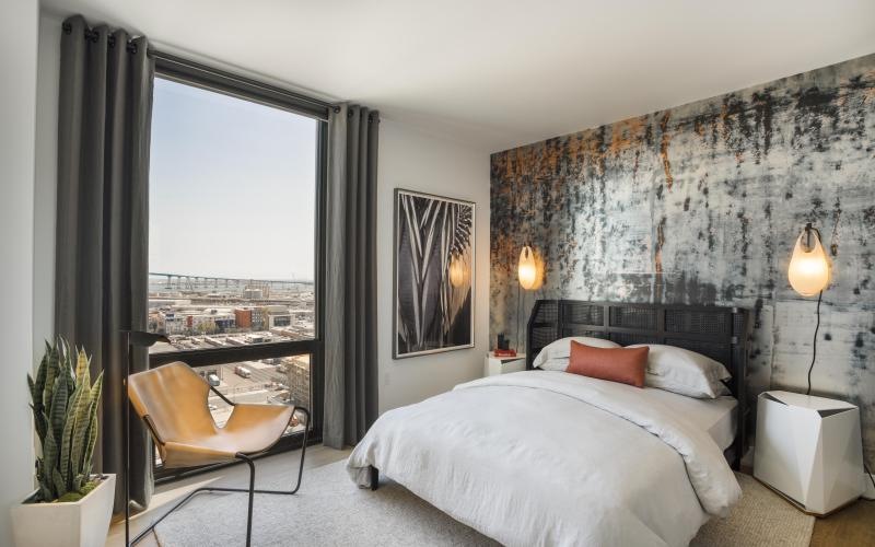 a bedroom with a large window
