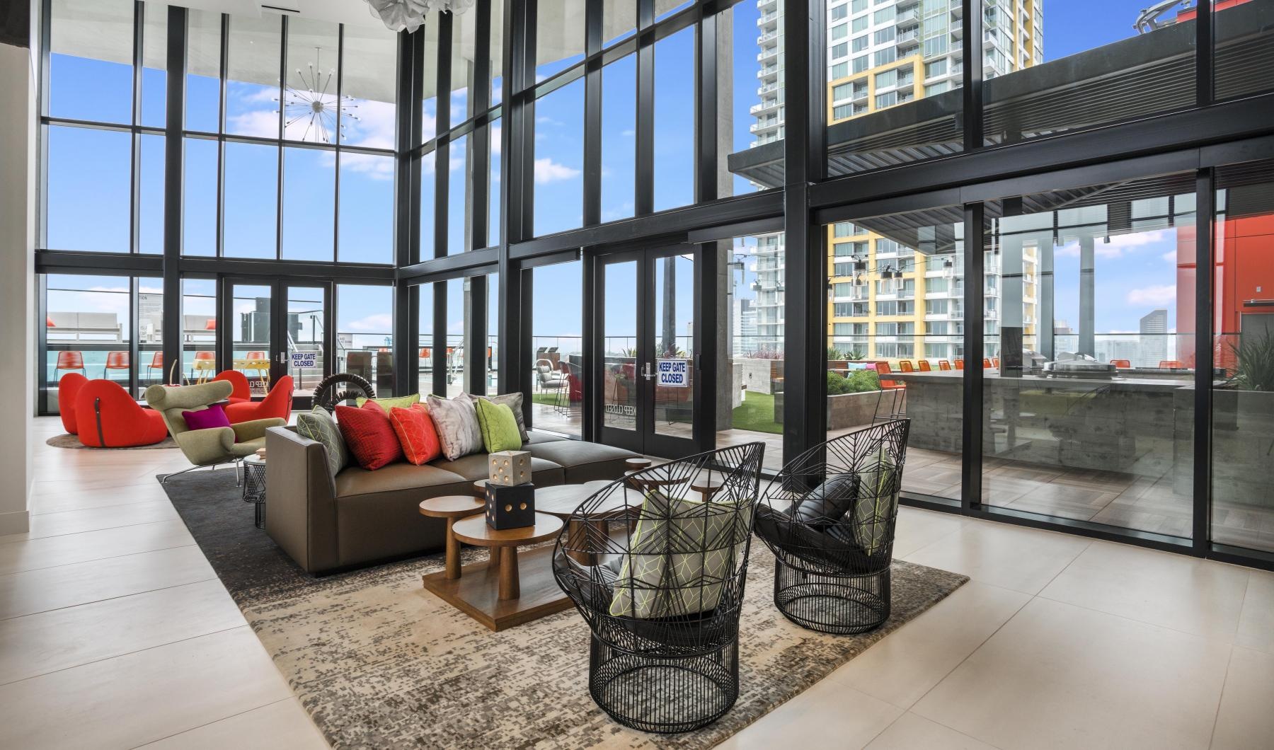 State-of-the-art amenities a room with a large glass wall, couches and chairs