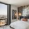a bedroom with a large window